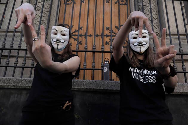 Anonymous For The Voiceless Demonstrates Against Animal Exploitation In Mexico City Members of the international animal rights organisation Anonymous for the Voiceless, perform the Go Vegan sign while demonstrating in the streets of the Historic Centre of Mexico City, against the consumption of animals on the occasion of Christmas and New Year s Eve during the COVID-19 health emergency in the country. Mexico City Mexico  Copyright: xGerardoxVieyrax originalFilename: vieyra-notitle211224_npfEm.jpg