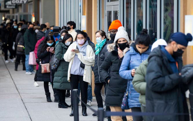 (211226) -- HALTON HILLS (CANADA), Dec. 26, 2021 -- People line up to enter a store at an outlet mall during Boxing Day sales in Halton Hills, Ontario, Canada, on Dec. 26, 2021. Boxing Day is one of the biggest shopping days in Canada. (Photo by Xinhua) CANADA-ONTARIO-HALTON HILLS-BOXING DAY SALES ZouxZheng 