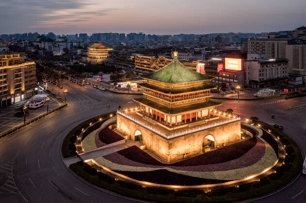 XI AN, CHINA - DECEMBER 26: Aerial view of illuminated Xi an Bell Tower on December 26, 2021 in Xi an, Shaanxi Province of China. Xi an conducted a citywide disinfection since Sunday night to prevent the COVID-19 spread.  Copyright: xVCGx CFP111363041509