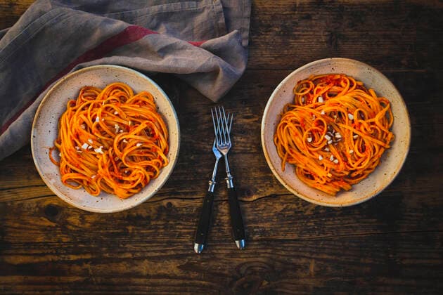 Studio shot of two bowls of vegan linguini with sauce, LVF09178