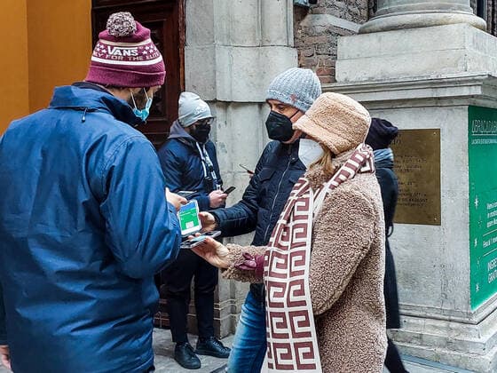 December 27, 2021, TURIN, Italia: People queue to enter the Egyptian Museum due to the Green Pass checks, in Turin, northern Italy, 27 December 2021. Premier Mario Draghi s government has brought in a series of new COVID-19 prevention measures, including the obligation to wear facemasks outdoors, due to the sharp upswing in contagion and the arrival of the Omicron variant. It was already mandatory for people to wear facemasks in enclosed public spaces. The government has also decide to close Italy s night clubs and dance halls and ban open-air parties that attract crowds of people until January 31. It has also reduced the duration of the Super Green Pass health certificate for people who are vaccinated for the coronavirus from nine to six - ZUMAa110 20211227_zaf_a110_008 Copyright: xTinoxRomanox