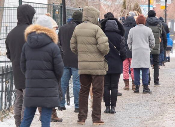 December 29, 2021, Montreal, PQ, Canada: People wait in line at a COVID-19 testing and vaccination site in Montreal, Wednesday, December 29, 2021, as the COVID-19 pandemic continues in Canada. Montreal Canada  - ZUMAc35_ 20211229_zaf_c35_007 Copyright: xGrahamxHughesx