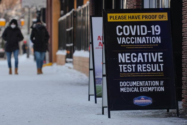 Daily Life In Edmonton During The Covid-19 Pandemic Proof of Covid-19 Vaccination or Negative Test Results sign outside The Commercial in Edmonton. On Thursday, December 30, 2021, in Edmonton, Alberta, Canada. Edmonton Canada  Copyright: xArturxWidakx originalFilename: widak-dailylif211230_npvzv.jpg