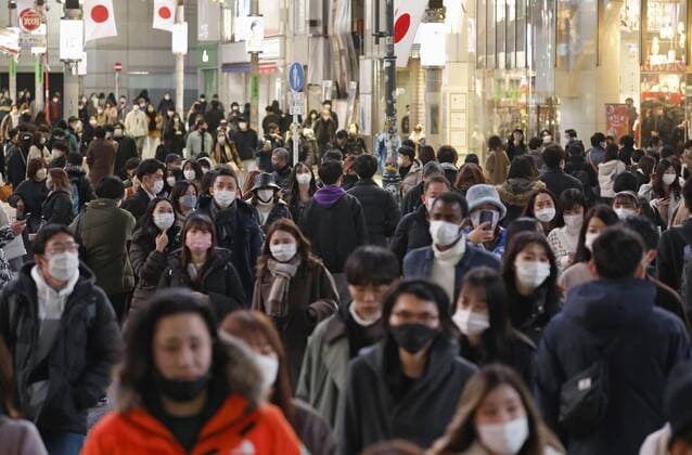 Scene of Tokyo amid coronavirus pandemic People wearing face masks walk in Tokyo s Shibuya district on Jan. 3, 2022, amid the coronavirus pandemic.  A14AA0001175313P