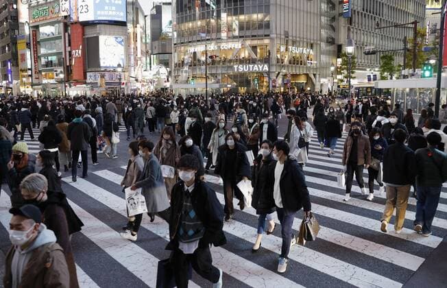 Scene of Tokyo amid coronavirus pandemic People wearing face masks walk in Tokyo s Shibuya district on Jan. 3, 2022, amid the coronavirus pandemic.  A14AA0001175314P