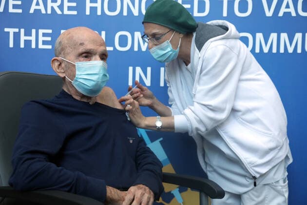 (220103) -- JERUSALEM, Jan. 3, 2022 -- A man receives his fourth dose of COVID-19 vaccine at a vaccination center in Jerusalem on Jan. 3, 2022. Israel on Monday reported 6,570 new COVID-19 cases, bringing the total number of infections in the country to 1,403,821, or nearly 15 percent of the total population, the state s health ministry said. ( via Xinhua) MIDEAST-JERUSALEM-COVID-19-CASES GideonxMarkowicz JINI 