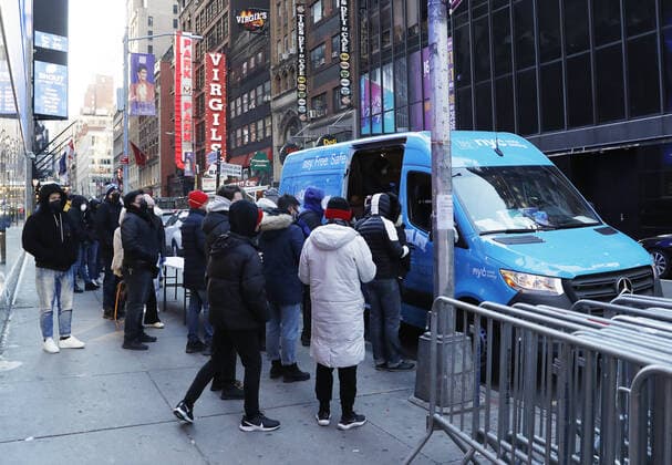 People wait in line to be tested for COVID-19 at a mobil testing site parked Times Square in New York City on Tuesday, January 4, 2022. The United States continues to set records for positive COVID cases.  NYP20220104122 JohnxAngelillo
