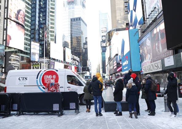 People wait in line to be tested for COVID-19 at a mobil testing site parked Times Square in New York City on Tuesday, January 4, 2022. The United States continues to set records for positive COVID cases.  NYP20220104124 JohnxAngelillo