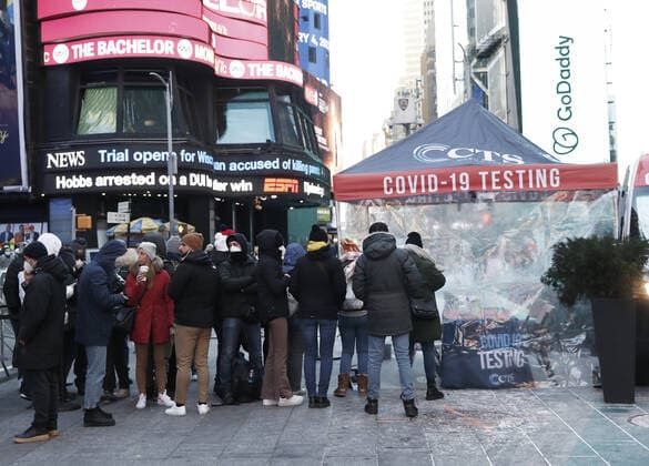 People wait in line to be tested for COVID-19 at a mobil testing site parked Times Square in New York City on Tuesday, January 4, 2022. The United States continues to set records for positive COVID cases.  NYP20220104118 JohnxAngelillo