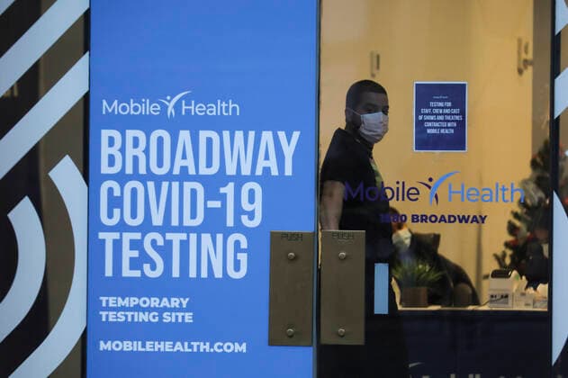 (220105) -- NEW YORK, Jan. 5, 2022 -- A staff member looks out from a COVID-19 testing site in New York, the United States, Jan. 4, 2022. Nearly all new U.S. COVID-19 cases last week were linked to the Omicron variant, the Centers for Disease Control and Prevention (CDC) reported on Tuesday, as the highly transmissible new strain has quickly overtaken the Delta variant and sparked new surges nationwide. ) U.S.-NEW YORK-COVID-19-OMICRON WangxYing 
