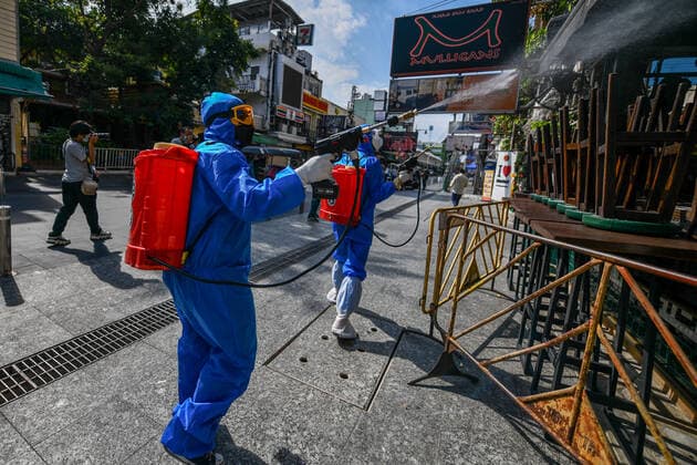Thailand: Clean-up after revelers tested positive for COVID-19 coronavirus at a tourist spot A Thai volunteer staff in a protective suit sprays disinfectant at a nightclub and restaurant during a clean-up operation after revelers tested positive for COVID-19 coronavirus at a tourist spot in Khao San road, during COVID-19 coronavirus infections linked with the Omicron variant have been detected putting Thailand at risk of a new wave hit by the pandemic. Thailand Copyright: VichanxPoti