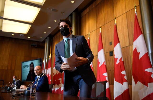 January 5, 2022, Ottawa, ON, CAN: Prime Minister Justin Trudeau leaves after participating in a news conference on the COVID-19 pandemic in Ottawa, on Wednesday, Jan. 5, 2022. Ottawa CAN  - ZUMAc35_ 20220105_zaf_c35_005 Copyright: xJustinxTangx