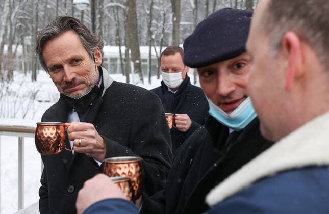 MOSCOW REGION, RUSSIA â€“ JANUARY 6, 2022: The German Chancellor s foreign and security policy adviser Jens Plotner (L) enjoys a hot drink in Arkhangelskoye museum estate before Normandy format talks with Deputy Chief of Staff of Russiaâ€™s Presidential Executive Office Dmitry Kozak (not pictured) and the French president s diplomatic advisor Emmanuel Bonne (C back). The talks will discuss Ukraine crisis de-escalation and strengthening strategic stability in Europe. Sergei Bobylev TASS  TS11E244