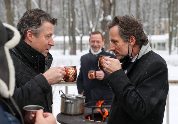 MOSCOW REGION, RUSSIA â€“ JANUARY 6, 2022: Germany s ambassador to Russia Geza Andreas von Geyr (L front), the German Chancellor s foreign and security policy adviser Jens Plotner (R front) and the French president s diplomatic advisor Emmanuel Bonne (back) enjoy hot drinks in Arkhangelskoye museum estate before Normandy format talks with Deputy Chief of Staff of Russiaâ€™s Presidential Executive Office Dmitry Kozak. The talks will discuss Ukraine crisis de-escalation and strengthening strategic stability in Europe. Sergei Bobylev TASS  TS11E245