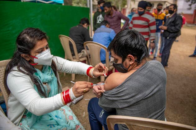 January 6, 2022, New Delhi, India: A teenager seen taking a vaccination shot at Janakpuri vaccination centre..Amid Omicron surge the national capital has set up about 159 vaccination centers in the initial phase of the drive, now over 10 million youngsters have been vaccinated. New Delhi India - ZUMAs197 20220106_zaa_s197_190 Copyright: xPradeepxGaurx