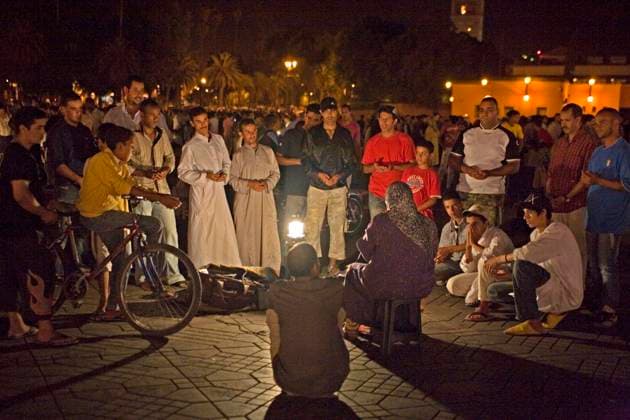 Storyteller in front of eager audience, Marrakech, Morocco, Africa Copyright: imageBROKER/RaimundxFranken iblrfn07206751.jpg