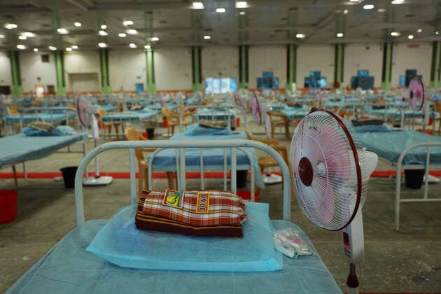 January 7, 2022, Chennai, Tamil Nadu, India: Indian workers install beds at a makeshift COVID-19 coronavirus isolation ward with more than 900 beds inside Chennai Trade Centre in Chennai. StateÃ‚ governments in India are enforcing more severe travel restrictions and partial lockdowns as the country struggles to deal with the third Covid-19 pandemic and rising omicron infections. Chennai India - ZUMAl172 20220107_zip_l172_006 Copyright: xSrixLoganathanx
