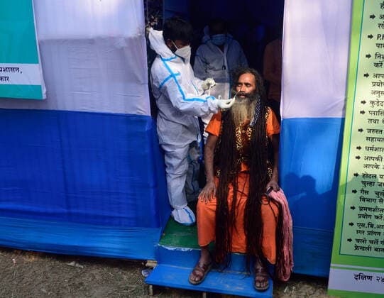 January 7, 2022, Kolkata, West Bengal, India: A monk is being tested for Covid-19 at a Gangasagar Transit Camp before heading to the Gangasagar mela in sagar island. Kolkata India - ZUMAs197 20220107_zaa_s197_036 Copyright: xSumitxsanyalx