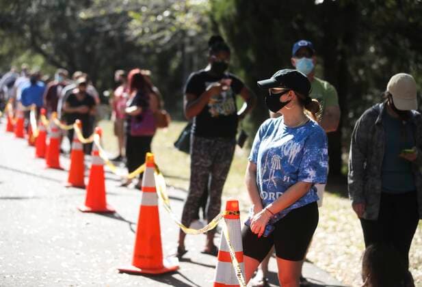 January 7, 2022, Tampa, Florida, USA: Margarita Schneider, 24, from Tampa, looks on as she waits in the walk up Covid testing site at Al Lopez Park, 4810 N Himes Ave, on Friday, Jan. 7, 2022 in Tampa. The state is reporting record numbers of Covid infections primarily due to the current wave of the Omicron variant. Testing sites have seen an uptick as well. Schneider, who was about half way through the line, had been waiting about 35 minutes, she said. â€oeI like that thereâ€⠢s a line. It means that people are taking precautions,†Schneider said. â€oeI want to be safe and know Iâ€⠢m good before I go to the clubs and before I see my family this weekend. Tampa USA - ZUMAs70_ 20220107_zan_s70_009 Copyright: xDirkxShaddx