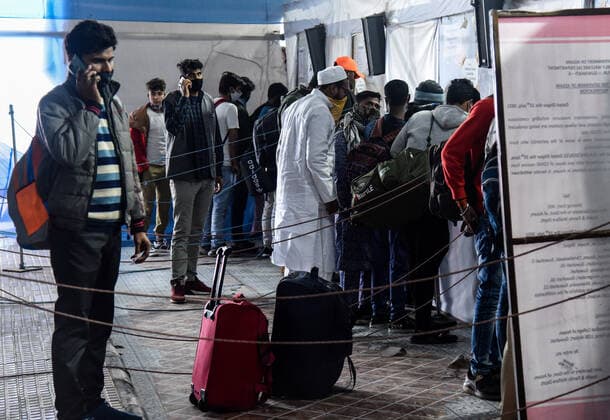January 8, 2022, Guwahati, India: Passengers showing their COVID-19 fully vaccinated certificate in fully vaccinated passenger verification booth, at Guwahati Railway Station, in Guwahati, Assam, India on Saturday, Jan. 8, 2022. Daily cases of Covid-19 surged by 21% in 24 hours as India recorded more than hundred thousand fresh infections. Guwahati India - ZUMAt232 20220108_zip_t232_007 Copyright: xDavidxTalukdarx