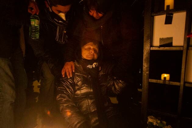 January 8, 2022, TORONTO, ON, Canada: A woman is helped after collapsing while mourning at a vigil in Toronto on Saturday, January 8, 2022 in memory of the 176 victims of Ukraine International Airlines Flight PS752 that was shot down in Iranian forces two years ago. TORONTO Canada  - ZUMAc35_ 20220108_zaf_c35_129 Copyright: xChrisxYoungx