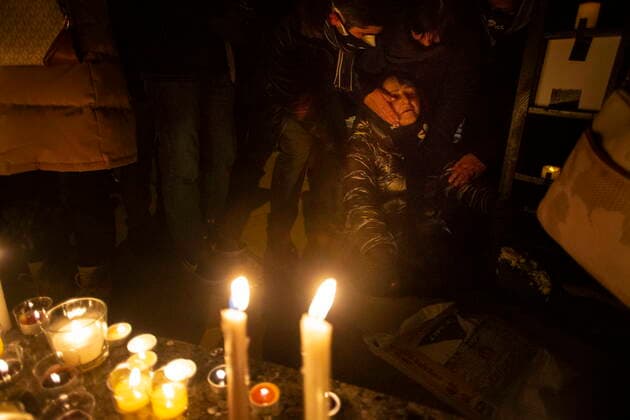 January 8, 2022, TORONTO, ON, Canada: A woman is helped after collapsing while mourning at a vigil in Toronto on Saturday, January 8, 2022 in memory of the 176 victims of Ukraine International Airlines Flight PS752 that was shot down in Iranian forces two years ago. TORONTO Canada  - ZUMAc35_ 20220108_zaf_c35_131 Copyright: xChrisxYoungx