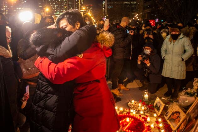 January 8, 2022, TORONTO, ON, Canada: Two women mourn at a vigil in Toronto on Saturday, January 8, 2022 in memory of the 176 victims of Ukraine International Airlines Flight PS752 that was shot down by Iranian forces two years ago. TORONTO Canada  - ZUMAc35_ 20220108_zaf_c35_139 Copyright: xChrisxYoungx