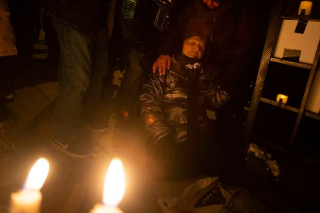 January 8, 2022, TORONTO, ON, Canada: A woman is helped after collapsing while mourning at a vigil in Toronto on Saturday, January 8, 2022 in memory of the 176 victims of Ukraine International Airlines Flight PS752 that was shot down by Iranian forces two years ago. TORONTO Canada  - ZUMAc35_ 20220108_zaf_c35_142 Copyright: xChrisxYoungx