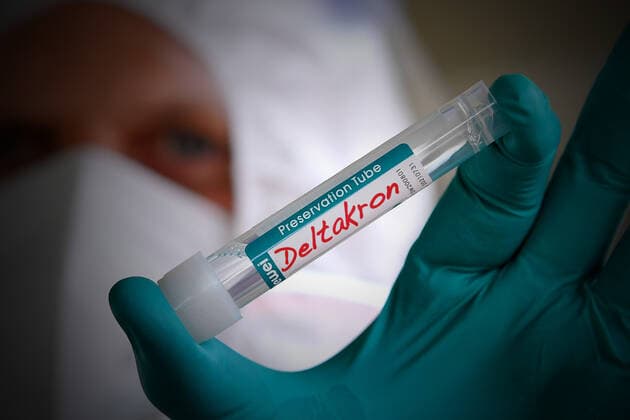 Theme image,Symbol photo DELTAKRON After Delta and Omikron, a new variant of the coronavirus is now threatening to spread In Cyprus, the Deltakron variant of the corona virus has been discovered Corona PCR Test Preservation tube,tubes containing the swabs of people who have undergone corona testing in a drive through testing station