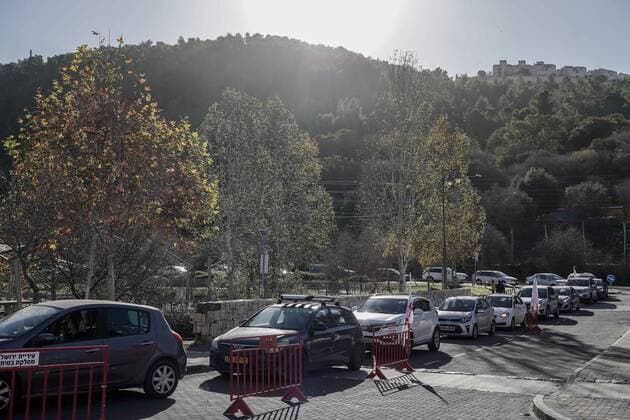 January 10, 2022, Jerusalem, Israel: Drivers queue for hours for COVID-19 tests at the Ein Yael drive thru complex in Jerusalem as Israel faces a surge in Coronavirus infection most likely due to the Omicron variant. Magen David Adom, IsraelÃ¢â‚¬â ¢s leading EMS, conducts PCR tests for the elderly and Antigen tests for all others as a shortage of PCR test kits threatens the near future. Although Antigen tests have proven significantly inaccurate providing both FALSE POSITIVE and FALSE NEGATIVE results, some of the countryÃ¢â‚¬â ¢s economy and education system relies on frequent testing for those not vaccinated. Jerusalem Israel - ZUMAa126 20220110_zap_a126_009 Copyright: xNirxAlonx