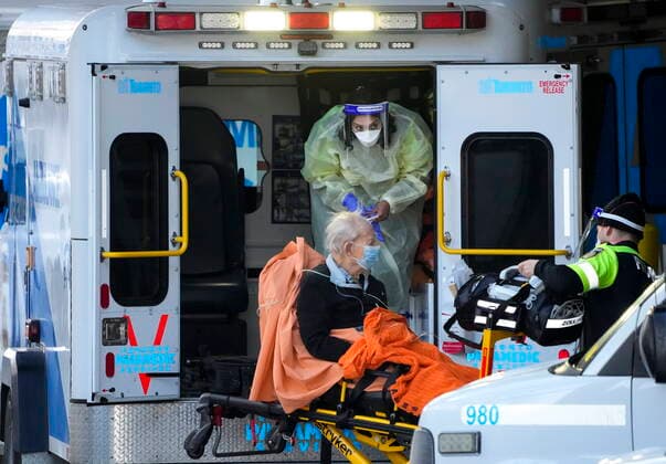 January 10, 2022, TORONTO, ON, CANADA: Paramedics transfer a patient out of their ambulance to the emergency department at Michael Garron Hospital during the COVID-19 pandemic in Toronto on Monday, January 10, 2022. Ambulances have been in short supply in some regions through out the province of Ontario. TORONTO CANADA  - ZUMAc35_ 20220110_zaf_c35_016 Copyright: xNathanxDenettex