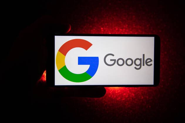 Illustration Of Google Logo Google logotype on a smartphone held by a hand with a dark red background. Google closeup logo displayed on a phone screen, smartphone the logo or the search engine in various backgrounds like keyboard, dark illuminated texture or a computer screen, as seen in this multiple exposure illustration, the company s symbol is globally recognized. Google, LLC is an American tech giant, a multinational technology company that specializes in Internet-related services and products, which include online advertising technologies, a search engine, cloud computing, software, and hardware. It is considered one of the Big Four - Big Tech technology companies in the U.S. and globally. Amsterdam, the Netherlands on January 10, 20  Copyright: xNicolasxEconomoux originalFilename: economou-notitle220110_npjCh.jpg