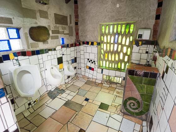 Urinal with ceramic tiles in the public toilet of the artist and architect Friedensreich Hundertwasser, Kawakawa, North Island, New Zealand, Oceania Copyright: imageBROKER/Karl-HeinzxSchein iblksc07217864.jpg