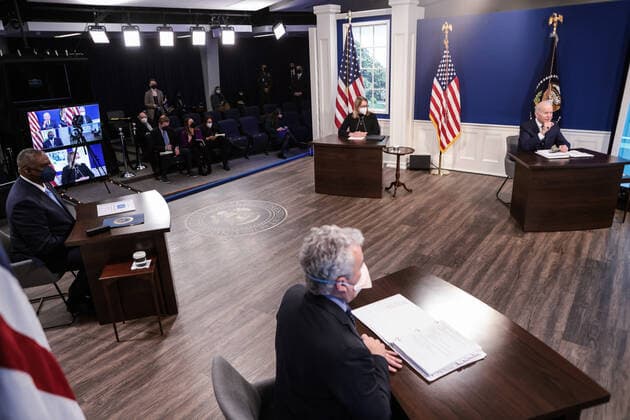 Secretary of Defense Lloyd J. Austin III and FEMA Administrator Deanne Criswell look on as President Joe Biden delivers an update on his Administration s whole-of-government COVID-19 surge response in South Court Auditorium of the Eisenhower Executive Office Building next to the White House on January 13, 2022 in Washington, DC.  wasp20220113110 OliverxContreras