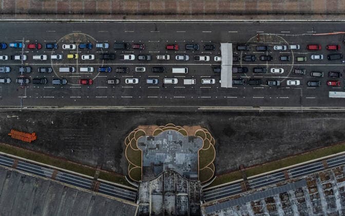 January 14, 2022, Manila, Philippines: A drone image shows motorists lining up to receive COVID-19 vaccines at a drive-thru vaccination site in Manila, Philippines on January 14, 2022. Coronavirus infections continue to soar amid the governmentÃ¢â‚¬â ¢s strict enforcement of health protocols. Today, more than 37,000 cases were recorded; the highest since the pandemic started. Manila Philippines - ZUMAs213 20220114_zap_s213_008 Copyright: xBasilioxSepex