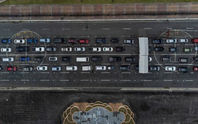 January 14, 2022, Manila, Philippines: A drone image shows motorists lining up to receive COVID-19 vaccines at a drive-thru vaccination site in Manila, Philippines on January 14, 2022. Coronavirus infections continue to soar amid the governmentÃ¢â‚¬â ¢s strict enforcement of health protocols. Today, more than 37,000 cases were recorded; the highest since the pandemic started. Manila Philippines - ZUMAs213 20220114_zap_s213_013 Copyright: xBasilioxSepex