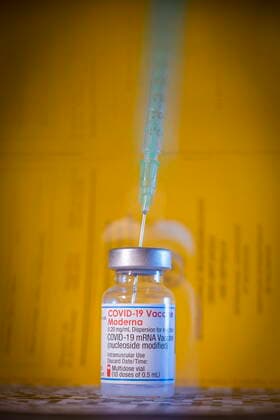Covid motif symbol image Covid vaccine in front of vaccination cards Bannewitz Saxony GERMANY
