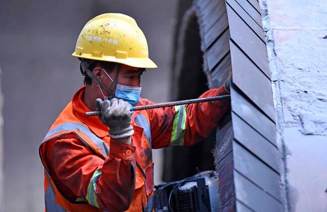 (220118) -- TIANJIN, Jan. 18, 2022 -- A staff member adjusts a shield tunneling machine at the construction site of Tianjin Subway Line 11 in north China s Tianjin, Jan. 17, 2022. Tianjin has taken efforts to ensure the project development of Subway Line 11 on time with strict epidemic prevention measures following a recent COVID-19 resurgence. ) CHINA-TIANJIN-COVID-19-CONSTRUCTION (CN) ZhaoxZishuo 