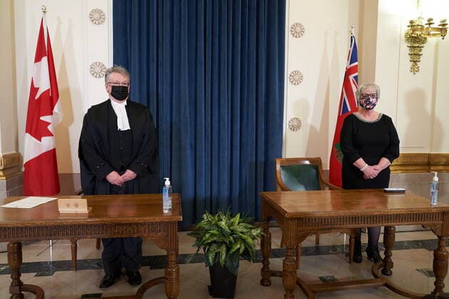 January 18, 2022, Winnipeg, MB, CANADA: Eileen Clarke, right, Minister of Municipal Relations, is sworn as she stands with Richard Chartier, Administrator of the Province at the Manitoba Legislative Building in Winnipeg, Manitoba, Tuesday January 18, 2022. Winnipeg CANADA  - ZUMAc35_ 20220118_zaf_c35_050 Copyright: xDavidxLipnowskix