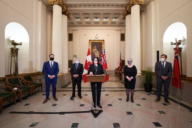 January 18, 2022, Winnipeg, MB, CANADA: Heather Stefanson, Premier of Manitoba, center, speaks to the media at a press conference following a swearing-in ceremony for her cabinet, along side Minister Andrew Smith, left, Minister Scott Johnston, second from left, Minister Eileen Clarke, second from right, and Minister Doyle Piwniuk, right) , at the Manitoba Legislative Building in Winnipeg on Tuesday January 18, 2022. Winnipeg CANADA  - ZUMAc35_ 20220118_zaf_c35_064 Copyright: xDavidxLipnowskix