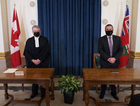 January 18, 2022, Winnipeg, MB, CANADA: Cliff Cullen, Minister of Economic Development, Investment and Trade, and Deputy Premier of Manitoba (right) is sworn in with Richard Chartier, Administrator of the Province at the Manitoba (left) Legislative Building in Winnipeg, Tuesday, January 18, 2022. Winnipeg CANADA  - ZUMAc35_ 20220118_zaf_c35_084 Copyright: xDavidxLipnowskix