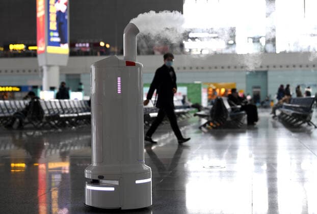 (211219) -- HEFEI, Dec. 19, 2021 -- Air environment automatic sterilizer robot Xiao Chuang sprays disinfectant at Hefei South Railway Station in Hefei, east China s Anhui Province, Jan. 18, 2022. Air environment automatic sterilizer robot Xiao Chuang, intelligent temperature measuring robot Da Bai and ground cleaning and disinfecting robot Xiao De have been in service for COVID-19 prevention and control during the annual Spring Festival travel rush in Hefei. ) CHINA-ANHUI-RAILWAY STATION-ROBOTS (CN) ZhouxMu 