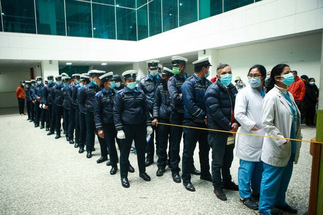 January 19, 2022, Bhaktapur, Bagmati, Nepal: Traffic police personnels stand in queue to administer booster dose against COVID-19 at a inoculation center at Bir Hospital in Nepali capital Kathmandu. Front line workers working at hospital as well as other places have continued to test positive for the contagion as the Himalayan Nation struggles with the third wave of infection. Bhaktapur Nepal - ZUMAm204 20220119_zip_m204_001 Copyright: xAmitxMachamasix