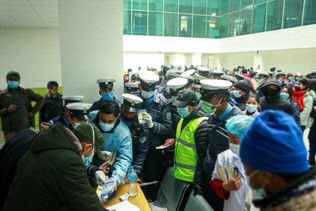 January 19, 2022, Bhaktapur, Bagmati, Nepal: Paramedics and traffic police personnel submit their vaccination card to register for booster dose against COVID-19 at a inoculation center at Bir Hospital in Nepali capital Kathmandu. Front line workers working at hospital as well as other places have continued to test positive for the contagion as the Himalayan Nation struggles with the third wave of infection. Bhaktapur Nepal - ZUMAm204 20220119_zip_m204_005 Copyright: xAmitxMachamasix