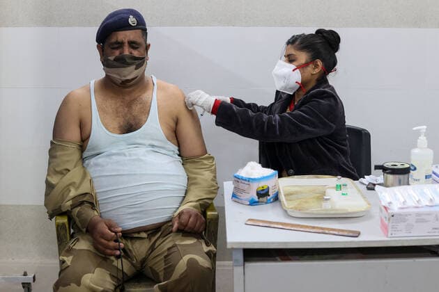 January 19, 2022, New Delhi, New Delhi, India: A frontline worker receive a booster dose of the COVISHIELD vaccine against the coronavirus disease (COVID-19), manufactured by Serum Institute of India, at a vaccination centre, in a school. New Delhi India - ZUMAb219 20220119_zip_b219_012 Copyright: xKarmaxSonamxBhutiax