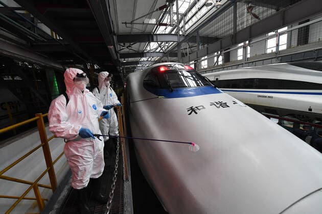 (220120) -- NANNING, Jan. 20, 2022 -- Staff members disinfect a bullet train at a maintenance base in Nanning, south China s Guangxi Zhuang Autonomous Region, Jan. 20, 2022. China Railway Nanning Group Co., Ltd. has strictly implemented measures on COVID-19 prevention and control during the Spring Festival travel season which kicked off Monday. ) CHINA-GUANGXI-NANNING-TRAINS-DISINFECTION (CN) LuxBoan 
