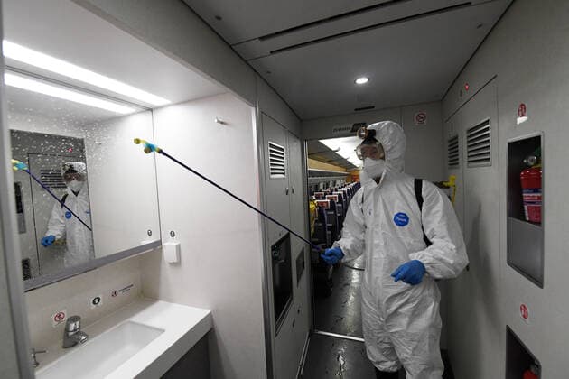 (220120) -- NANNING, Jan. 20, 2022 -- A staff member conducts disinfection work on a train at a maintenance base in Nanning, south China s Guangxi Zhuang Autonomous Region, Jan. 20, 2022. China Railway Nanning Group Co., Ltd. has strictly implemented measures on COVID-19 prevention and control during the Spring Festival travel season which kicked off Monday. ) CHINA-GUANGXI-NANNING-TRAINS-DISINFECTION (CN) LuxBoan 