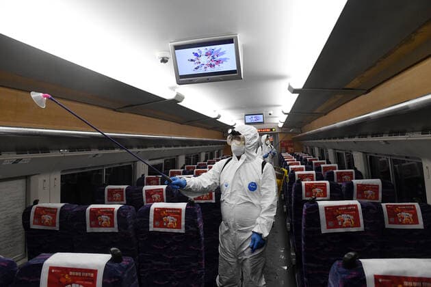 (220120) -- NANNING, Jan. 20, 2022 -- Staff members conduct disinfection work on a train at a maintenance base in Nanning, south China s Guangxi Zhuang Autonomous Region, Jan. 20, 2022. China Railway Nanning Group Co., Ltd. has strictly implemented measures on COVID-19 prevention and control during the Spring Festival travel season which kicked off Monday. ) CHINA-GUANGXI-NANNING-TRAINS-DISINFECTION (CN) LuxBoan 