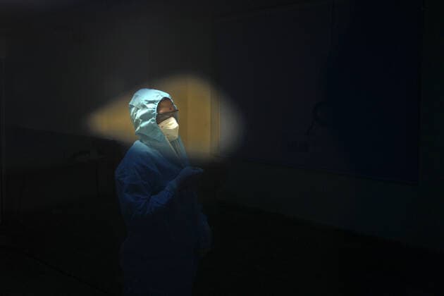 January 21, 2022, Chennai, Tamil Nadu, India: An Indian health worker is seen wearing the Personal Protective Equipment (PPE) kit inside the Chennai Trade Centre which is converted into a makeshift COVID-19 care center in Chennai. Chennai India - ZUMAl172 20220121_zip_l172_001 Copyright: xSrixLoganathanx