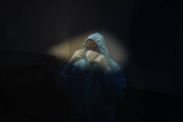 January 21, 2022, Chennai, Tamil Nadu, India: An Indian health worker is seen wearing the Personal Protective Equipment (PPE) kit inside the Chennai Trade Centre which is converted into a makeshift COVID-19 care center in Chennai. Chennai India - ZUMAl172 20220121_zip_l172_002 Copyright: xSrixLoganathanx